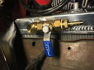 Removed petcock valve and installed proper valve with tubing to drain into a pan.