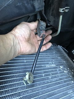 loose wire hanging in front of engine.